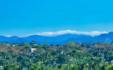 Mountains mountain panorama cliffs hills rocks and hilly tropical landscape in Puerto Escondido Oaxaca Mexico.の写真素材