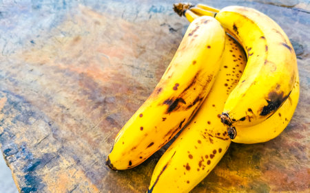 Bananas banana fruit fruits on wooden table in Zicatela Puerto Escondido Oaxaca Mexico.の写真素材