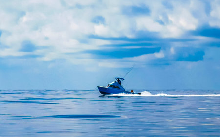 Boat trip tour from Cancun to Island Mujeres Isla Contoy and Whale shark tour with natural tropical seascape panorama and blue turquoise clear water and view from boat in Quintana Roo Mexico.の写真素材