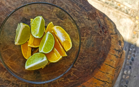 Oranges limes grapes lemon grapefruit citrus fruits on the white plate for preparing breakfast or lunch in Playa del Carmen Mexico.の写真素材