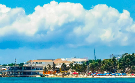 Tropical mexican caribbean beach landscape panorama at Constituyentes pier with corals stones boulders rocks and clear turquoise blue water in Playa del Carmen Mexico.の写真素材