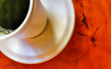 Cup of americano black coffee with spoon and plate on table food and drink in the restaurant in Zicatela Puerto Escondido Oaxaca Mexico.の写真素材