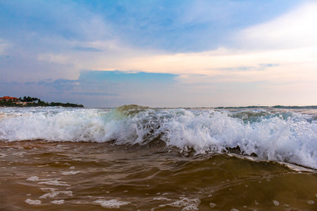 Beautiful sunny landscape panorama with huge powerful waves and clear water in Bentota Beach Galle District Southern Province Sri Lanka island.の写真素材