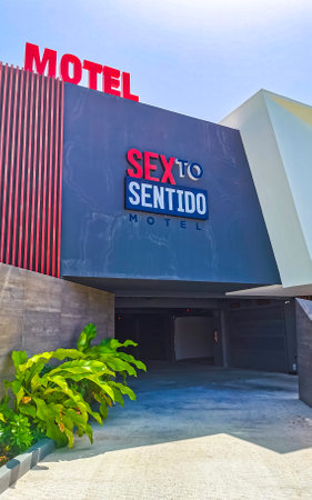 Playa del Carmen Quintana Roo Mexico July 12, 2021 Modern buildings and architecture hotels resorts and apartments Motel Sex to Sentido in tropical paradise with palm trees in Playa del Carmen Mexico.のeditorial素材