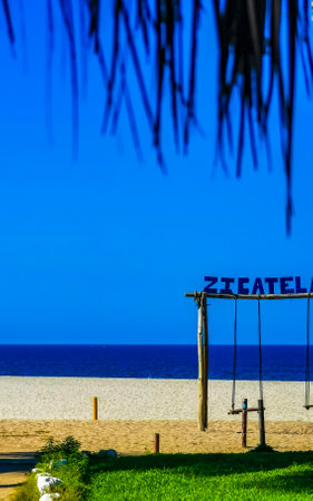 Puerto Escondido Oaxaca Mexico January 23, 2023 Romantic paradise swing on the beach in Zicatela Puerto Escondido Oaxaca Mexico.のeditorial素材