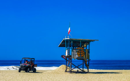 Puerto Escondido Oaxaca Mexico January 27, 2023 Beach watchtower with Mexican flag in Zicatela Puerto Escondido Oaxaca Mexico.のeditorial素材