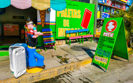 Puerto Escondido Oaxaca Mexico February 01, 2023 Typical beautiful colorful tourist street road and sidewalk with city life cars traffic buildings hotels bars restaurants and people in Zicatela Mexico.のeditorial素材