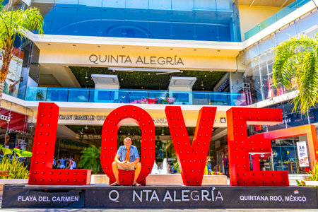 Playa del Carmen Quintana Roo Mexico March 26, 2021 Red love lettering sign and symbol in La Quinta Avenida in Playa del Carmen Quintana Roo Mexico.のeditorial素材