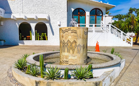 Puerto Escondido Oaxaca Mexico January 20, 2023 Typical beautiful colorful tourist street road and sidewalk with city life cars traffic buildings hotels bars restaurants and people in Zicatela Mexico.のeditorial素材