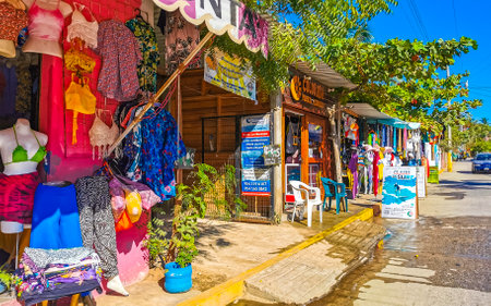 Puerto Escondido Oaxaca Mexico January 27, 2023 Typical beautiful colorful tourist street road and sidewalk with city life cars traffic buildings hotels bars restaurants and people in Zicatela Mexico.のeditorial素材
