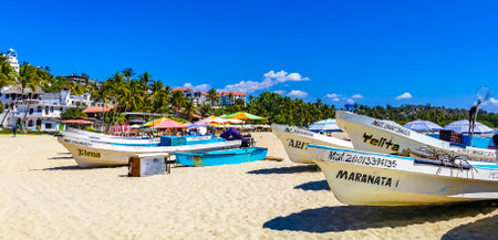 Puerto Escondido Oaxaca Mexico February 15, 2023 Fishing boats at the harbor and beach by Zicatela in Puerto Escondido Oaxaca Mexico.のeditorial素材