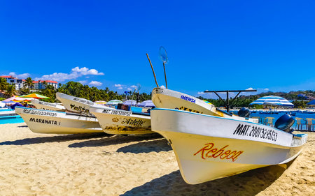 Puerto Escondido Oaxaca Mexico February 15, 2023 Fishing boats at the harbor and beach by Zicatela in Puerto Escondido Oaxaca Mexico.のeditorial素材