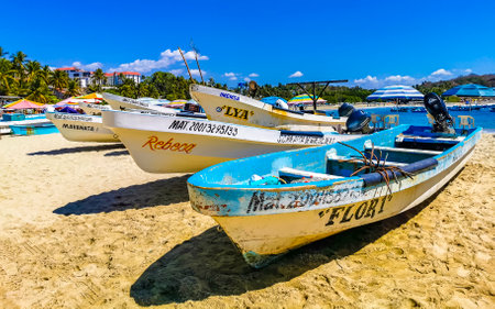 Puerto Escondido Oaxaca Mexico February 15, 2023 Fishing boats at the harbor and beach by Zicatela in Puerto Escondido Oaxaca Mexico.のeditorial素材