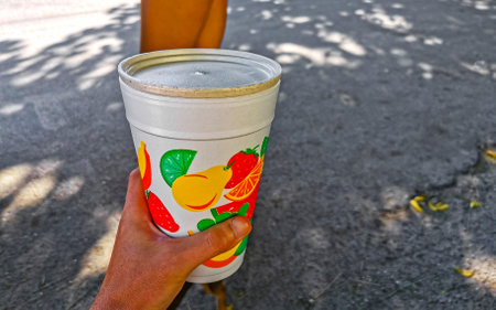 Green healthy juice smoothie in to go cup in Playa del Carmen Quintana Roo Mexico.