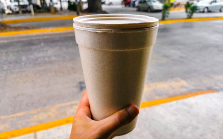 Green healthy juice smoothie in to go cup in Playa del Carmen Quintana Roo Mexico.