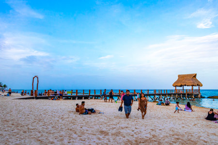 Playa del Carmen Quintana Roo Mexico August 14, 2023 Tropical mexican caribbean beach landscape panorama with clear turquoise blue water and jetty pier with palapa bungalow in Punta and Playa Xcalacoco Playa del Carmen Mexico.のeditorial素材