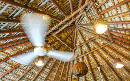 White fan under palapa roof in Zicatela Puerto Escondido Oaxaca Mexico.の写真素材