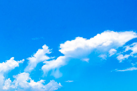 Blue sky with beautiful clouds cloud formations on sunny day in Playa del Carmen Mexico.の写真素材