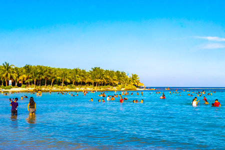 Playa del Carmen Quintana Roo Mexico August 5, 2023 Tropical Mexican Caribbean beach and cenote panorama view with a lot of fun people sun loungers parasols from Punta Esmeralda in Playa del Carmen Mexico.のeditorial素材