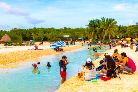Playa del Carmen Quintana Roo Mexico August 13, 2023 Tropical Mexican Caribbean beach and cenote panorama view with a lot of fun people sun loungers parasols from Punta Esmeralda in Playa del Carmen Mexico.のeditorial素材