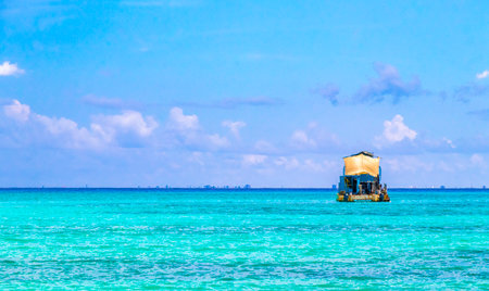 Boat yacht catamaran ship ferry jetty pier and harbor at the tropical Mexican Caribbean beach panorama view and turquoise blue water in Playa del Carmen and Cozumel island Mexico.の写真素材