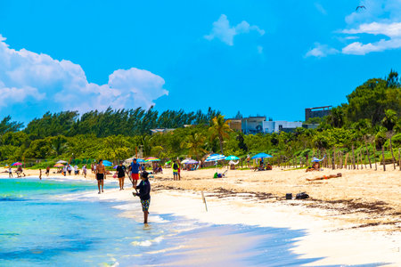 Playa del Carmen Quintana Roo Mexico September 9, 2023 Tropical Mexican Caribbean beach and sea with a lot of fun people sun loungers parasols turquoise water in Playa del Carmen Mexico.のeditorial素材
