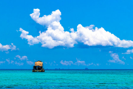Boat yacht catamaran ship ferry jetty pier and harbor at the tropical Mexican Caribbean beach panorama view and turquoise blue water in Playa del Carmen and Cozumel island Mexico.の写真素材