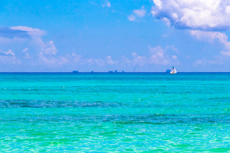 Tropical Mexican Caribbean sea and beach landscape panorama view to Cozumel island cityscape with clear turquoise blue water in Playa del Carmen Quintana Roo Mexico.の写真素材