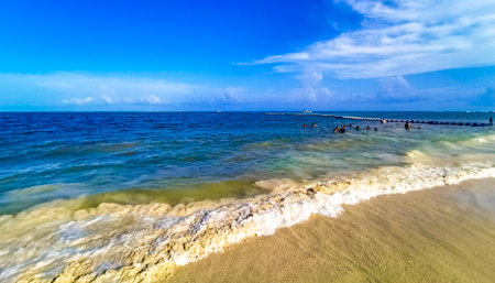 Playa del Carmen Quintana Roo Mexico July 20, 2023 Tropical Mexican Caribbean beach and sea with a lot of fun people sun loungers parasols turquoise water in Playa del Carmen Mexico.のeditorial素材