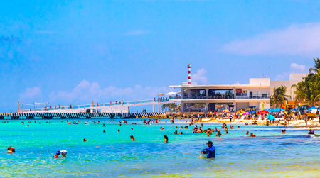 Playa del Carmen Quintana Roo Mexico August 5, 2023 Tropical Mexican Caribbean beach and sea with a lot of fun people sun loungers parasols turquoise water in Playa del Carmen Mexico.のeditorial素材