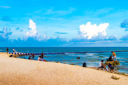 Playa del Carmen Quintana Roo Mexico August 13, 2023 Tropical Mexican Caribbean beach and sea with a lot of fun people sun loungers parasols turquoise water in Playa del Carmen Mexico.のeditorial素材