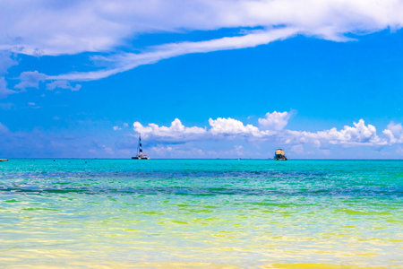 Boat yacht catamaran ship ferry jetty pier and harbor at the tropical Mexican Caribbean beach panorama view and turquoise blue water in Playa del Carmen and Cozumel island Mexico.の写真素材