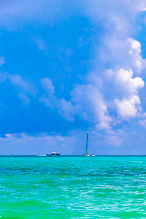 Sailing boat yacht ship ferry jetty pier and harbor at the tropical mexican beach panorama view from Playa 88 and Punta Esmeralda in Playa del Carmen Quintana Roo Mexico.の写真素材