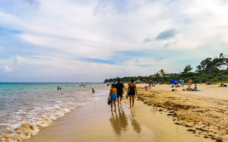 Playa del Carmen Quintana Roo Mexico July 29, 2023 Tropical Mexican Caribbean beach and sea with a lot of fun people sun loungers parasols turquoise water in Playa del Carmen Mexico.のeditorial素材