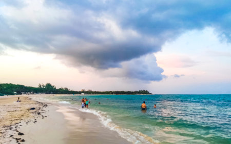 Playa del Carmen Quintana Roo Mexico August 1st, 2023 Tropical Mexican Caribbean beach and sea with a lot of fun people sun loungers parasols turquoise water in Playa del Carmen Mexico.のeditorial素材