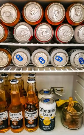 Playa del Carmen Mexico May 14, 2021 Corona beer bottle bottles can cans six food and drink in the fridge bar or restaurant in Playa del Carmen Quintana Roo Mexico.のeditorial素材