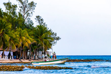 Playa del Carmen Quintana Roo Mexico August 14, 2023 Boat yacht catamaran ship ferry jetty pier and harbor at the tropical Mexican Caribbean beach panorama view and turquoise blue water in Punta Xcalacoco Playa del Carmen.のeditorial素材