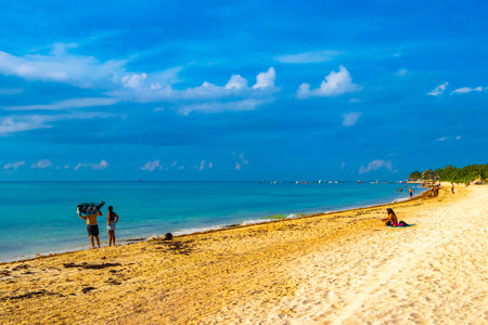 Playa del Carmen Quintana Roo Mexico August 5, 2023 Tropical Mexican Caribbean beach and sea with a lot of fun people sun loungers parasols turquoise water in Playa del Carmen Mexico.のeditorial素材