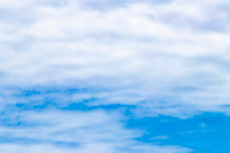 Blue sky with beautiful clouds cloud formations on sunny day in Playa del Carmen Mexico.