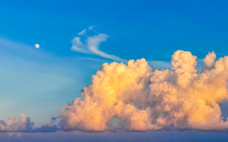 Colorful golden sky and clouds with sunset in Playa del Carmen Quintana Roo Mexico.の写真素材