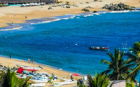 Puerto Escondido Oaxaca Mexico March 01, 2023 Fishing boats at the harbor and beach by Zicatela in Puerto Escondido Oaxaca Mexico.のeditorial素材