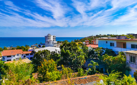 Puerto Escondido Oaxaca Mexico March 01, 2023 Beautiful tropical and natural city and seascape landscape panorama view with pacific ocean sea palms palm trees and beach with waves of Zicatela.のeditorial素材