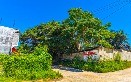 Puerto Escondido Oaxaca Mexico October 03, 2022 Typical beautiful colorful tourist street road and sidewalk with city life cars traffic buildings hotels bars restaurants and people in Zicatela Mexico.のeditorial素材