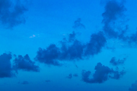 Colorful golden sky and clouds with sunset in Playa del Carmen Quintana Roo Mexico.の写真素材