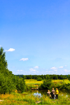 Cuxhaven Lower Saxony Germany July 7th 2010 Children occupying themselves at the lake in nature in Hemmoor Hechthausen Cuxhaven Lower Saxony Germany.のeditorial素材