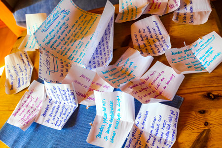 Lots of pieces of paper on the wooden table in Hemmoor Hechthausen Cuxhaven Lower Saxony Germany.のeditorial素材