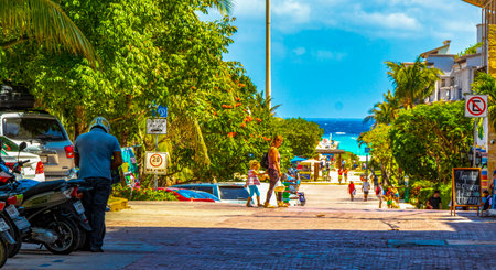 Typical street road and cityscape of La Quinta Avenida with restaurants shops stores people souvenirs and building in Playa del Carmen Playa del Carmen Quintana Roo Mexico.のeditorial素材