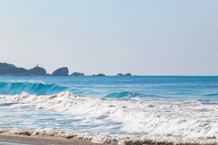 Extremely huge big surfer waves on the beach at La Punta de Zicatela Puerto Escondido Oaxaca Mexico.