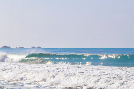 Extremely huge big surfer waves on the beach at La Punta de Zicatela Puerto Escondido Oaxaca Mexico.