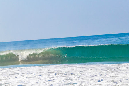 Extremely huge big powerful surfer waves on the beach in Zicatela Puerto Escondido Oaxaca Mexico.